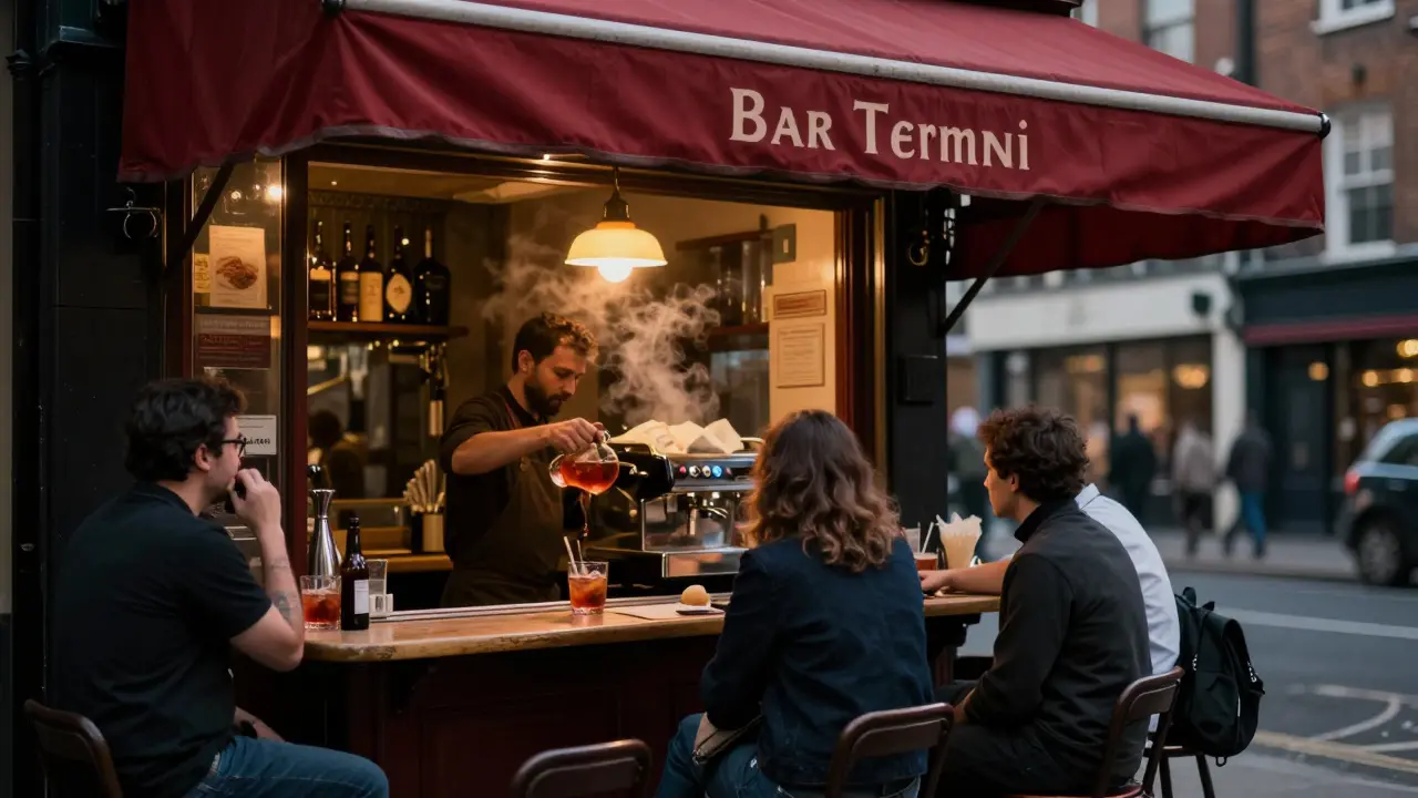Bar Termini in Soho at night, a barman pouring Negronis as locals chat quietly under soft lamplight.