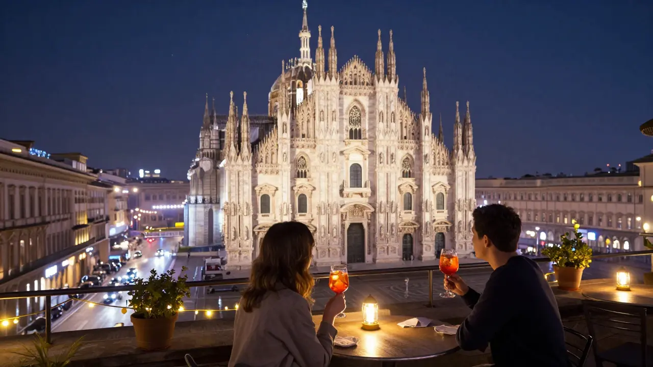 A quiet rooftop terrace in Milan at night with a view of the glowing Duomo and two people sipping cocktails.